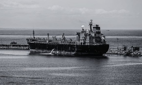 Carrier the Jullie loading in November 1975, with the 1000th cargo of oil & gas for Japan